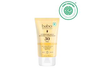 Babo Botanicals sunscreen tube with sunflower and EWG Verified logo on a black background