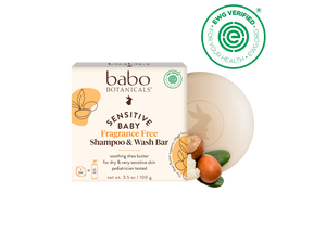 Babo Botanicals sensitive baby shampoo and wash bar with packaging on a black background