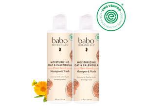 Two bottles of babo Botanicals shampoo and wash with a black background