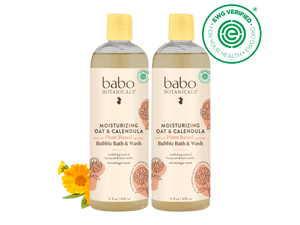 Two bottles of Babo Botanicals moisturizing bubble bath and wash on a black background with a green EWG Verified logo.