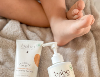 Baby holding lotion for irritated skin
