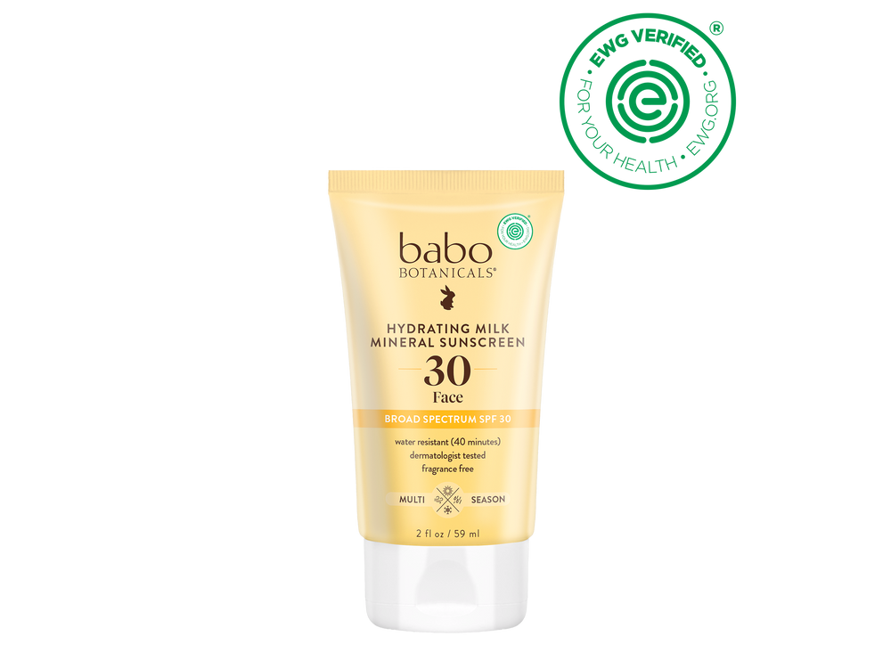 Babo Botanicals sunscreen tube with sunflower and EWG Verified logo on a black background