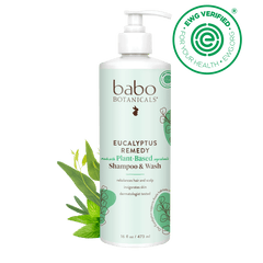 Babo Botanicals Eucalyptus Remedy shampoo & wash bottle with green leaves on a black background