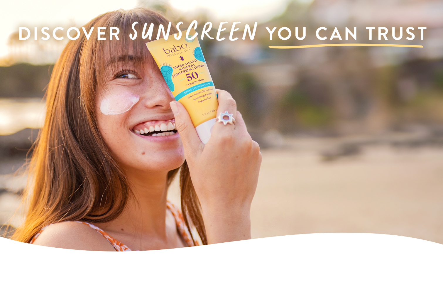 Babo Botanicals-discover sunscreen you can trust- woman smiling with super shield mineral sunscreen spf 50